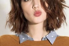 a reddish brunette wavy midi bob with a messy part is a lovely idea that catches an eye