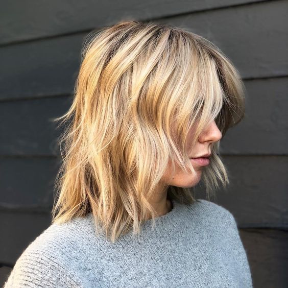 a shaggy and choppy golden blonde haircut with messy waves is a lovely idea that looks effortless