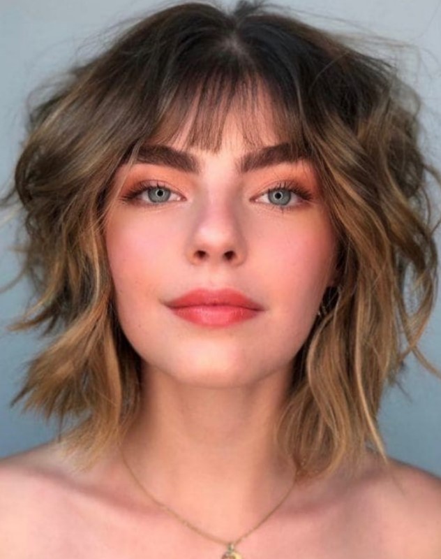a shaggy layered bob with a wispy fringe and a bit of balayage looks fresh and edgy