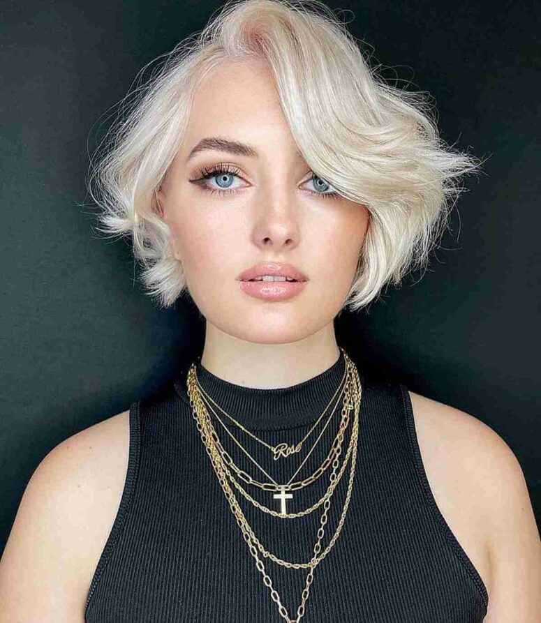 a short icy blonde bob with side bangs is an easy-going idea that will accent the eyes at its best