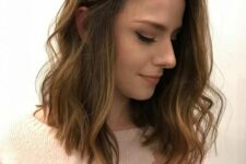 a soft brown medium-length haircut with caramel balayage and waves is a very chic and relaxed idea