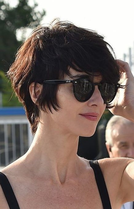 a super textural and layered bixie haircut in a dark tone, with bangs, is a fantastic and playful idea to try