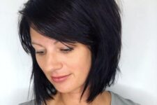 a textured stacked bob in black with side bangs is a cool idea, adn tapered layers help to frame the face
