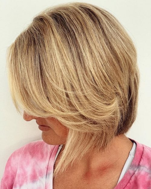 an A-line bob with side bangs done in a beautiful shade of blonde is a gorgeous idea for a dynamic look