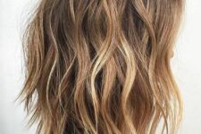 beautiful shaggy and choppy brown hair with blonde balayage and beach waves is a fantastic idea for the summer