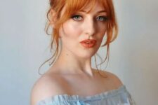 bright ginger hair in a top knot, with some face-framing hair and lovely Bardot bangs looks jaw-dropping