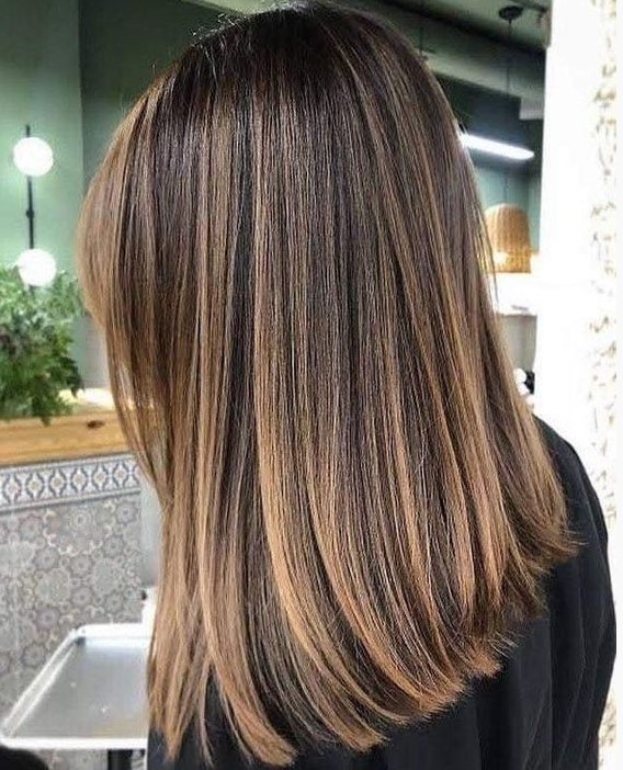 dark brown hair with caramel balayage and some babylights for a beautiful and contrasting look that brings interest