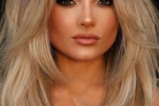 fantastic blonde medium hair with a darker root, layers including face-framing ones is a chic and cool idea