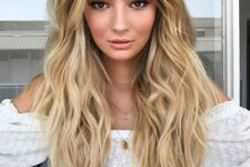 gorgeous long golden blonde hair with a darker root and beach waves is a fantastic idea for summer