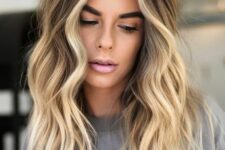 long brown hair with bright blonde balayage and a money piece plus beachy waves is a very lovely solution
