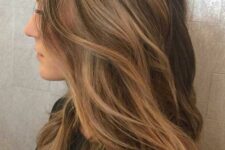 long brunette hair with caramel balayage  and beach waves is a very stylish and cool idea to rock