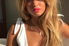 long golden blonde hair with a lot of texture and wispy Bardot bangs is a real copy of Bardot hair