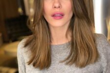 long light brown hair with some honey highlights and face-framing layers plus middle part is a gorgeous idea that is effortlessly chic