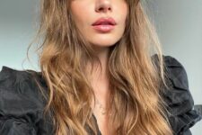 long light brunette hair with waves and classic Bardot bangs is a chic and beautiful idea to go for
