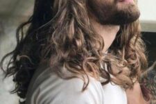 long wavy hair of a mousy brown shade plus a full beard will give you a Viking-inspired look