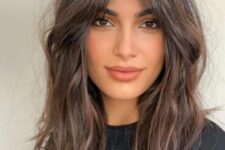 pretty messy dark brown hair with balayage, messy waves and central part plus face-framing layers