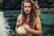 rock your wavy hair beach and surfer style pushing it back and adding highlights and ombre touches to it for a bleached look