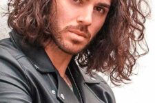 shoulder-length brunette wavy hair pused side is a cool solution, and adding beard to it will make the look even better