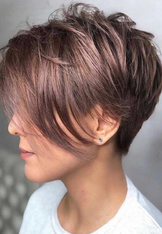 a shiny mauve pixie haircut with a long fringe is a cool and chic idea to rock, it looks bold yet its soft shade makes it more subtle