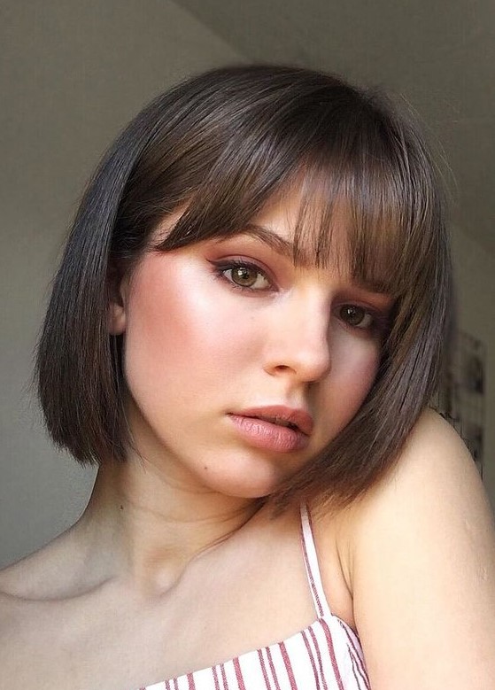 a classy shower brunette bob with curtain and classic bangs is a veyr cute and very girlish idea