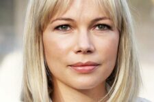 Michelle Williams rocking a long blonde bob with wispy bangs looks very stylish, classic and timeless
