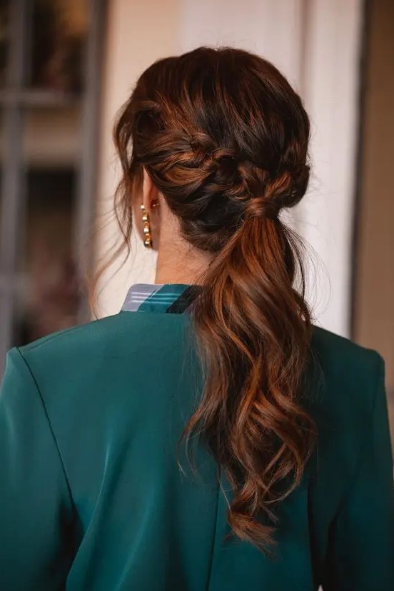a beautiful low ponytail with a braided halo and some face-framing locks is a cool idea for a modern or boho look