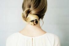a beautiful twisted low bun with an ombre blonde touch is a chic idea for long hair, it can be rocked with many bridal styles