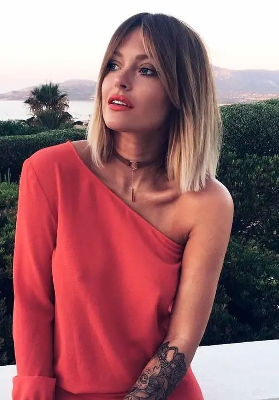 A bold ombre brown to icy blonde shoulder length bob with short curtain bangs is an amazing idea to rock