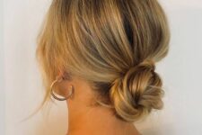 a cool twisted low bun with a bump on top and some face-framing hair is always a cool idea to rock