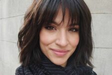 a dark brunette shaggy chin-length bob with outgrown wispy bangs is a lovely idea with plenty of texture