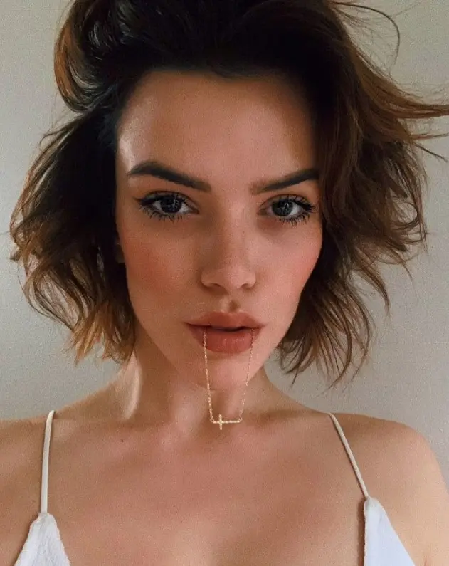 A flipped shaggy brown bob with messy texture and waves   change the parting as you like