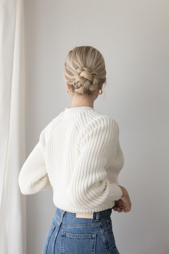 a gorgeous braided low bun on long hair, with a volume on top is idea for those who have long and thick hair