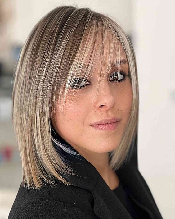 a long blonde bob with highlights and wispy bangs bring elegance and chic and will fit fine hair easily