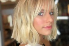 a long blonde bob with waves and wispy bangs is a bold and chic idea, you may rock it any time
