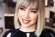 a lovely blonde long bob with a darker root and wispy bangs is a fantastic idea that always works