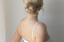 a lovely twisted low bun with a bit of waves and a volume on top plus some face-framing hair is a cool idea