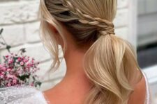 a low ponytail with a side Dutch braid, to make your pony really distinctive, a big, voluminous side braid will work perfectly on the look.