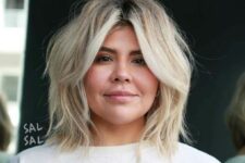 a messy blonde long bob with a darker root and textured waves plus curtain bangs is a lovely idea