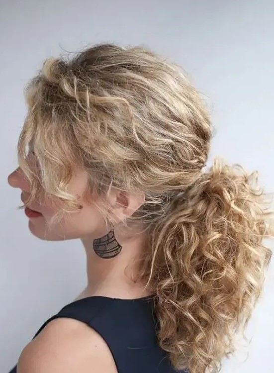 a messy low ponytail with bangs is a chic idea to rock for a modern look, it will take you a minute to make