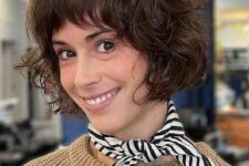 a short stacked French bob with feathered bangs and curls is a lovely and chic idea that is low-maintenance