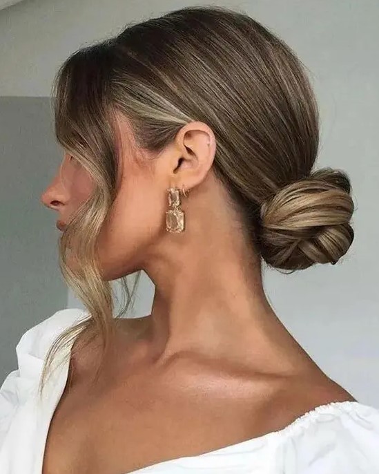 a sleek twisted low bun and some locks framing the face will give you a chic and stylish look instantly
