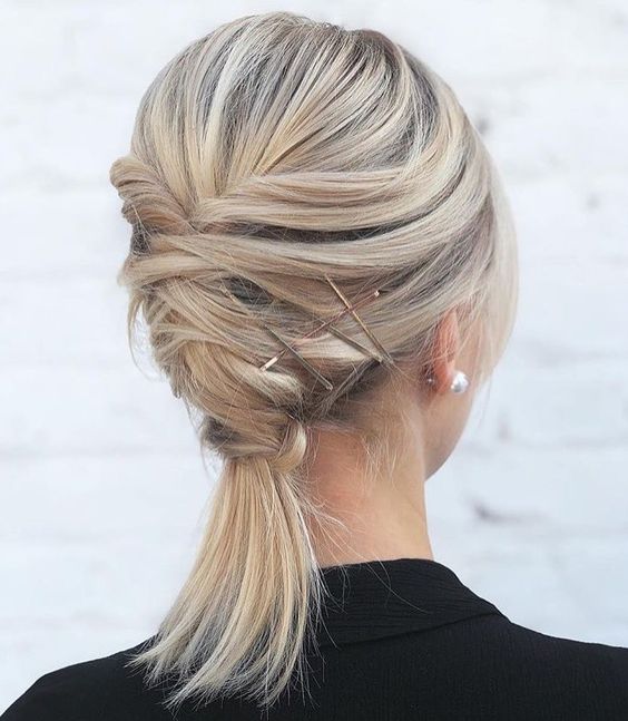 a twisted updo with a ponytail and a bump on top plus some hairpins is a creative for medium-length hair