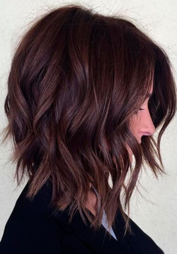 an auburn medium length haircut with waves and face-framing layers is a cool idea to rock in the flal or winter