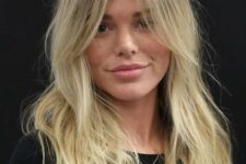 beautiful long blonde hair with curtain bangs and much texture looks catchy, interesting and lovely
