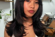 long black hair with a shaggy touch, face-framing layers and soft curtain bangs is a very beautiful and chic idea