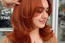 medium length hair, a butterfly haircut and a super bold copper color plus a lot of volume are a fantastic combo