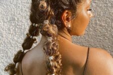 this unique take on pigtails looks pretty involved, but it’s surprisingly simple—definitely quick enough to make any time