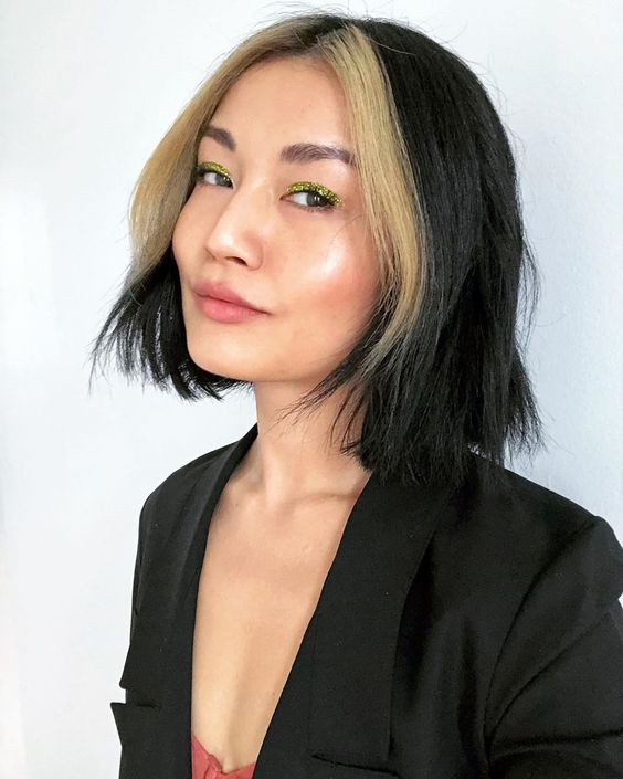 a black bob with a blonde money piece will give you a contrasting and super bold look