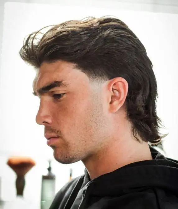 a black mullet with a modern feel is a cool hairstyle to rock right now, add some volume to make it look cooler