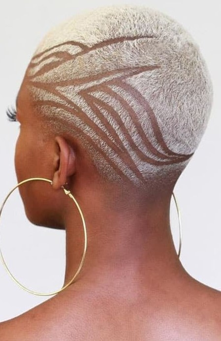 a bleached blonde buzz cut with a design is a great idea if you feel daring and rebellious